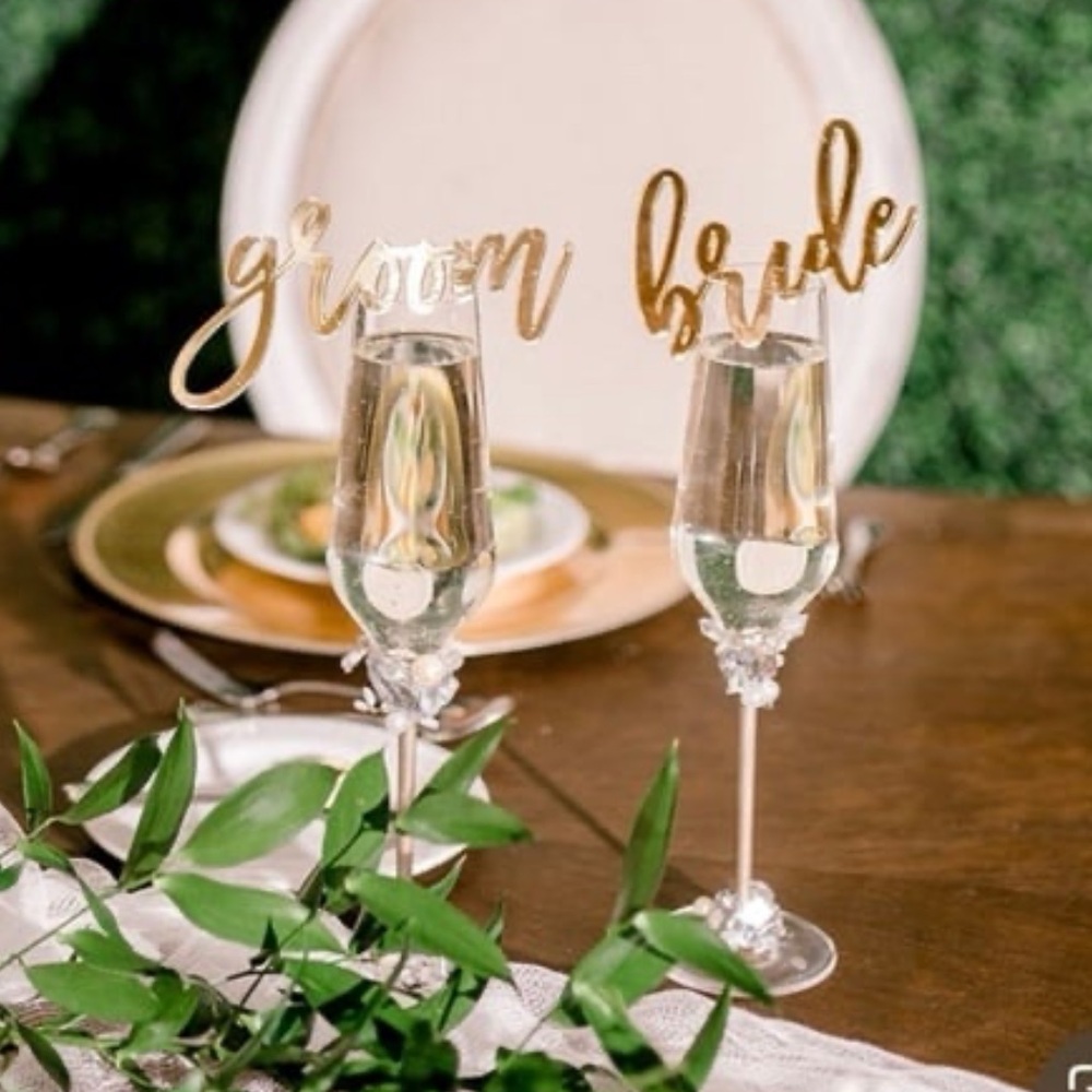 Gold acrylic bride and groom place cards